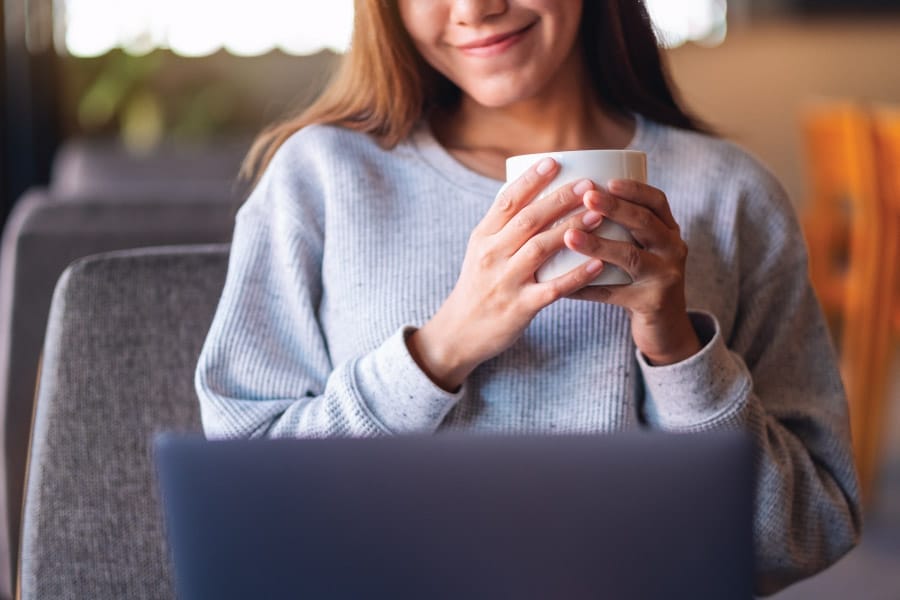 Female writing in diary enjoying kava
